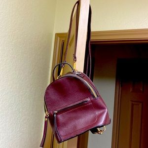 Backback bag with houndstooth interior.